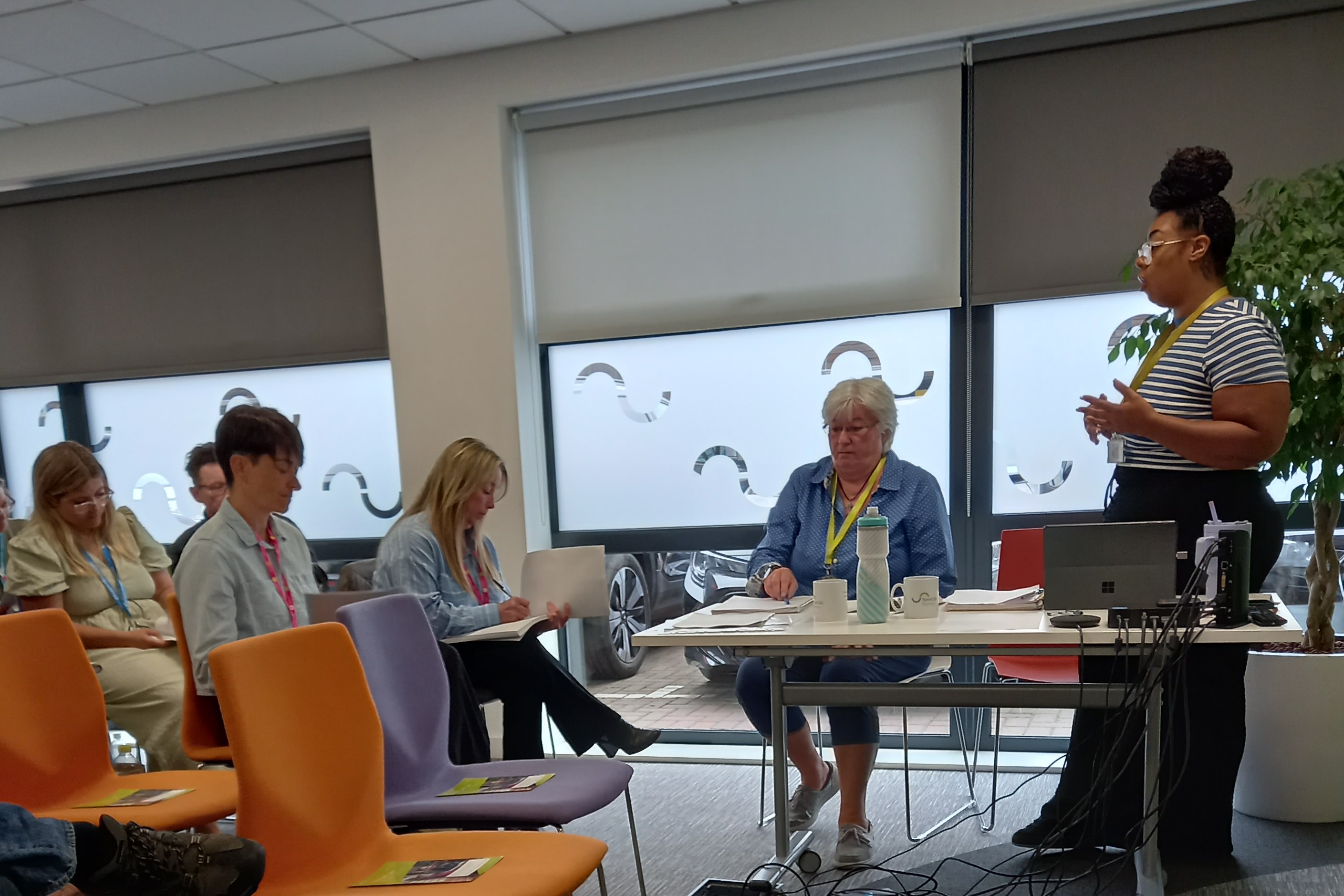 Newtide Homes housing manager Tanaya Burnett (right) giving a presentation on Newtide's Housing with Care schemes across Suffolk